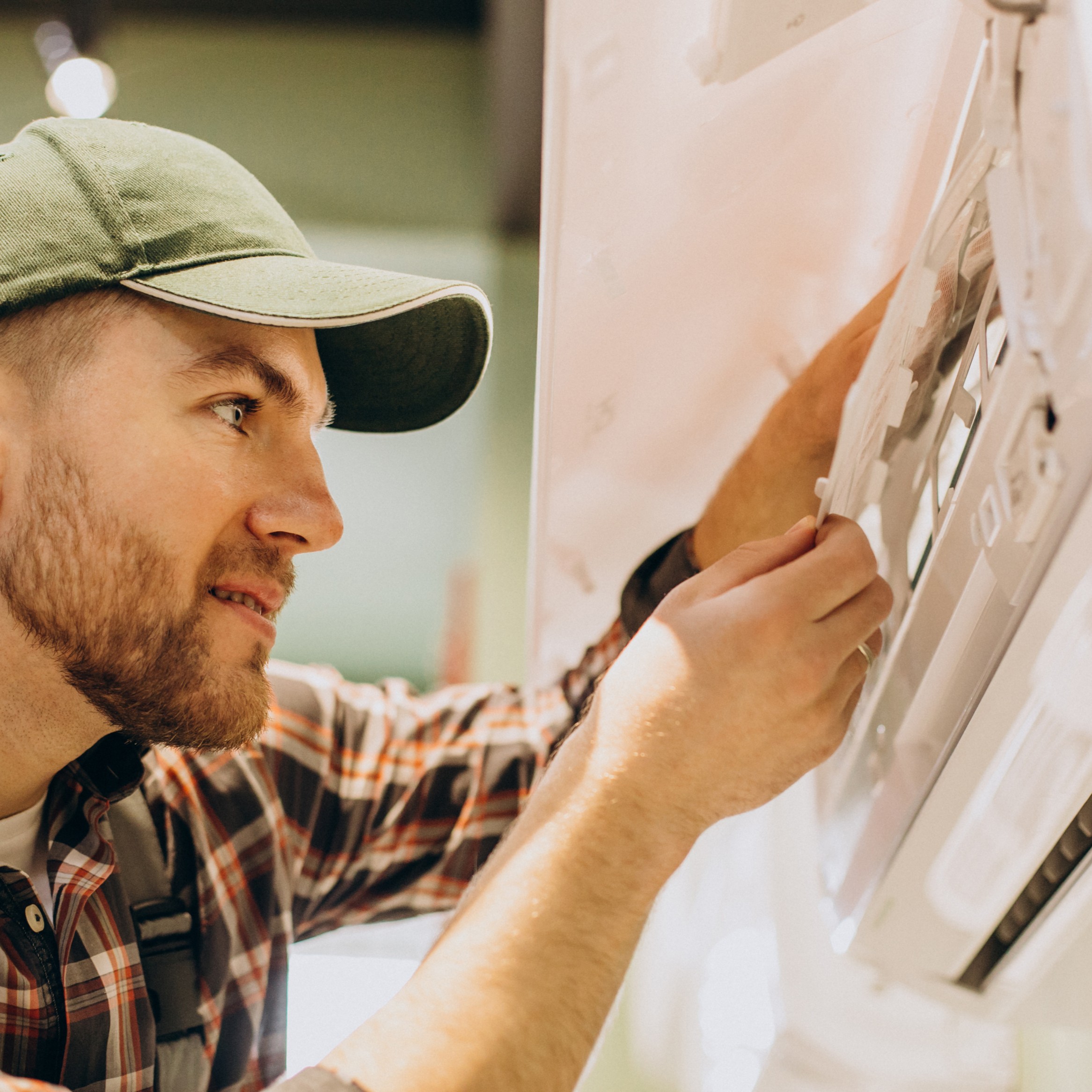 Repairman doing air conditioner servise